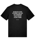 Black t-shirt with white text on a white background that says nobody ever studied the life of a person that never took a risk
