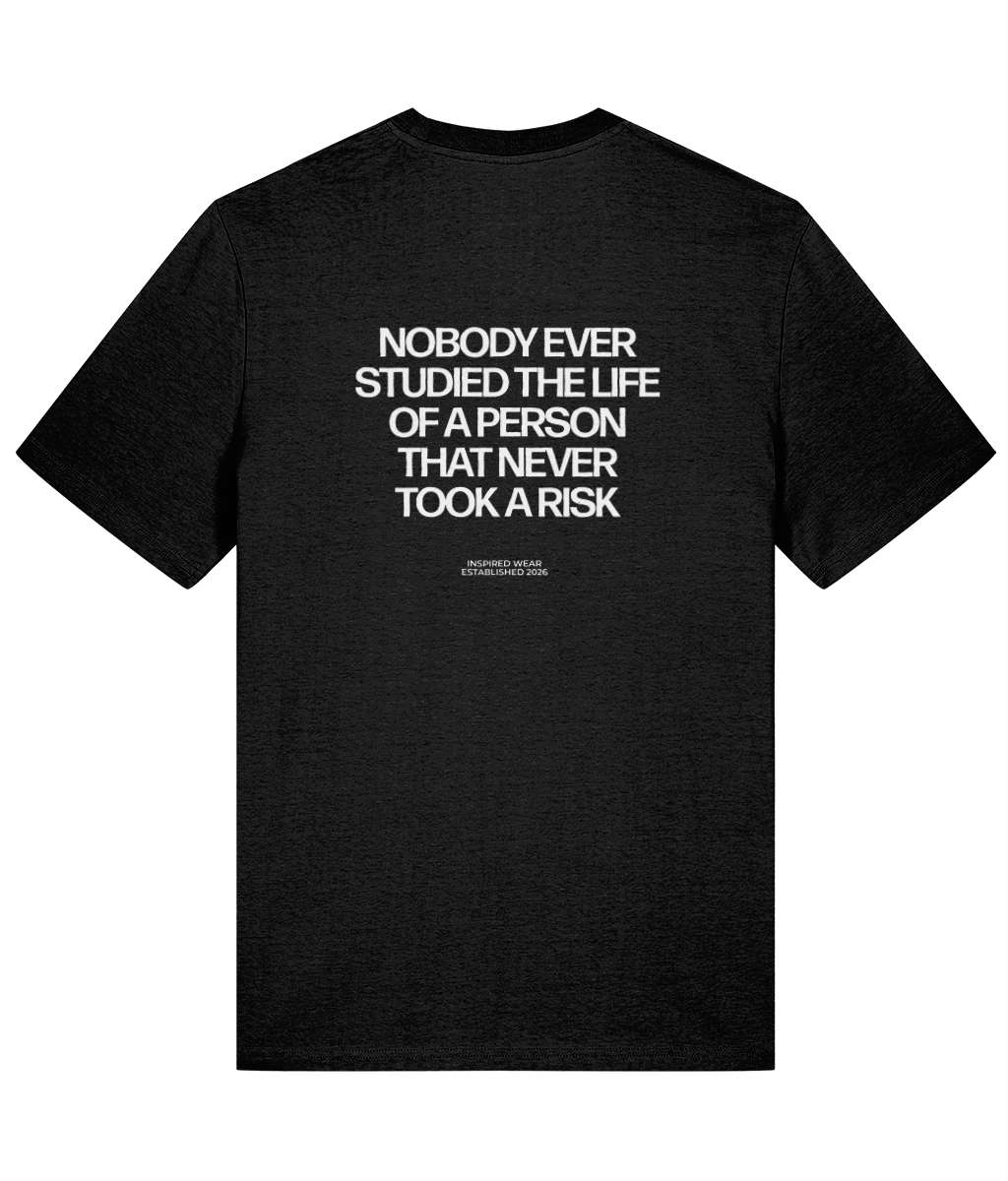Black t-shirt with white text on a white background that says nobody ever studied the life of a person that never took a risk

